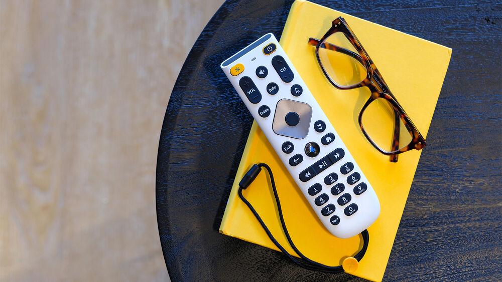 new large button remote with glasses on a side table