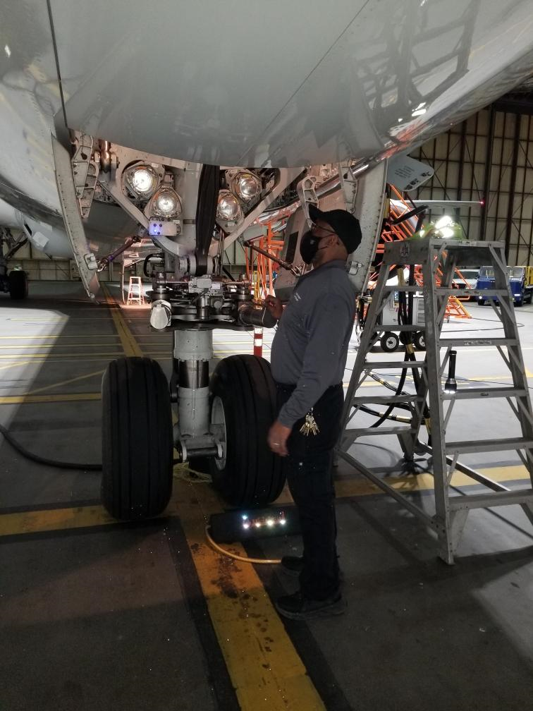 LAX Aviation Maintenance Technical Crew Chief, David Mansker examining a Boeing 787-9. David Mansker