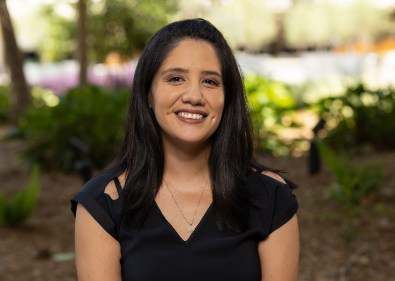 Woman in a black shirt, smiling