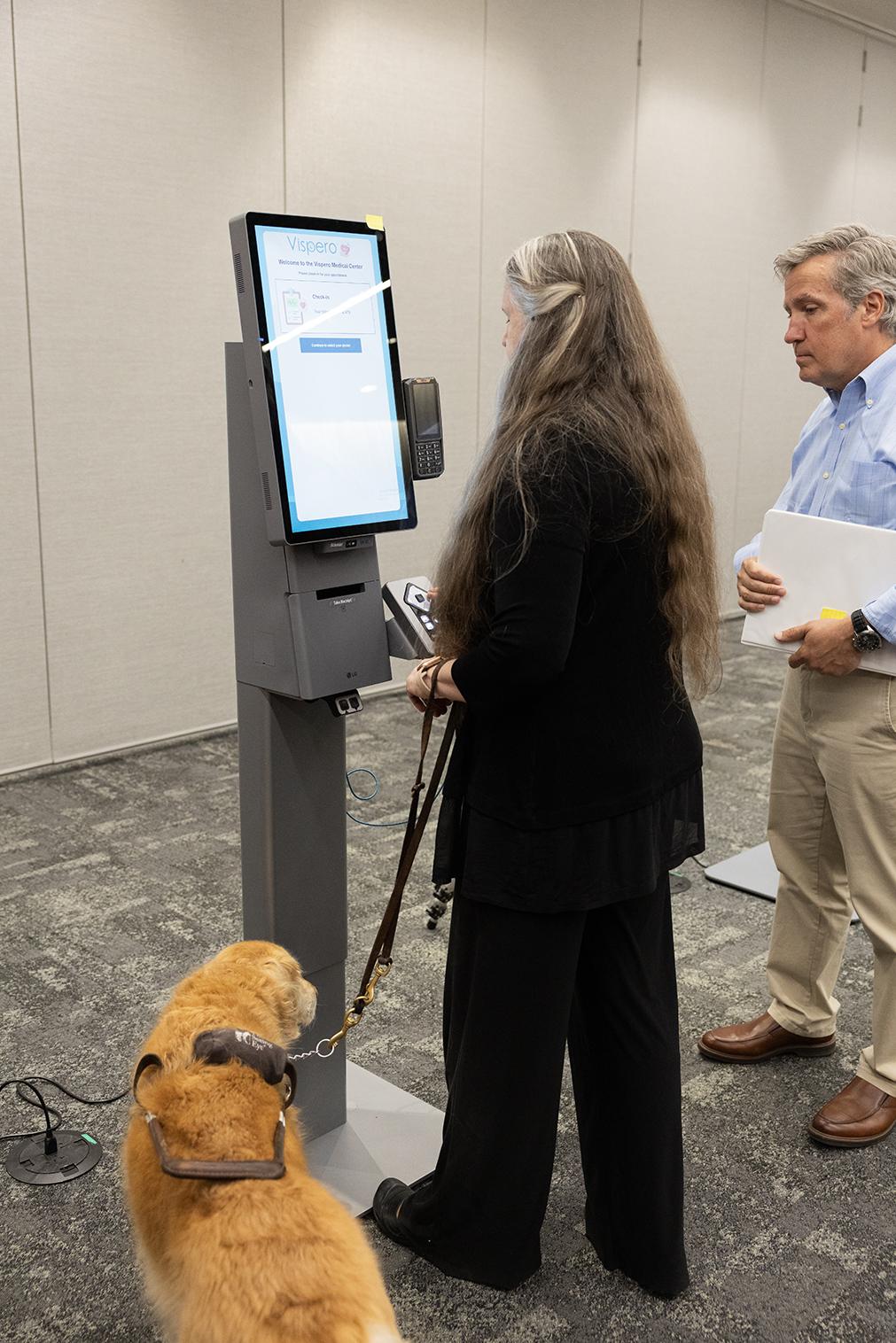 person at Self-Ordering Kiosk