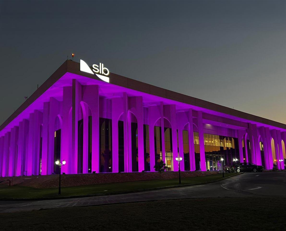 slb building lit up in purple