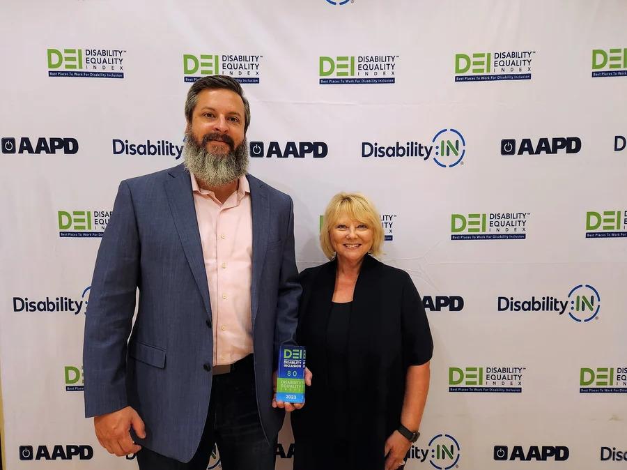 Ericsson employees, Chris Ranucci and Donna Erhardt, accepting the award at the Disability:IN National Conference & Expo " "