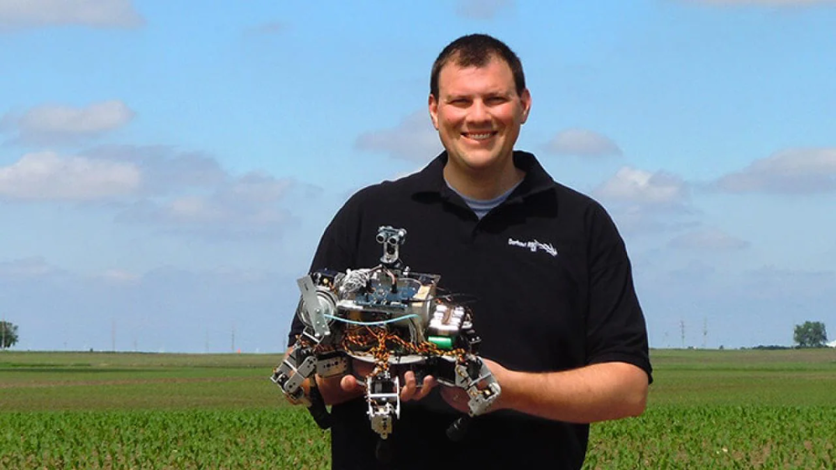 Inventor and engineer David Dorhout from Des Moines, Iowa with his little agri-crab robot.
