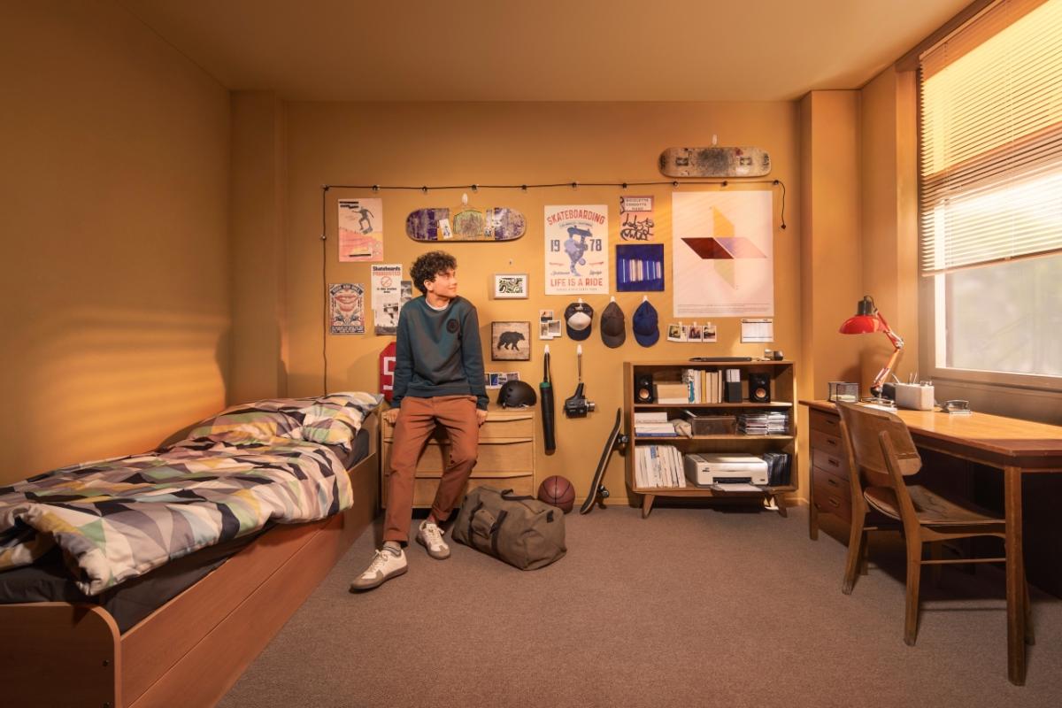 student sitting in dorm room