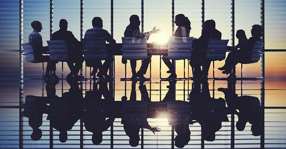 group of people sitting at table