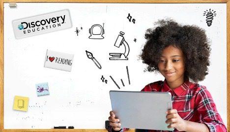 A child looking at a tablet, with various graphic icons