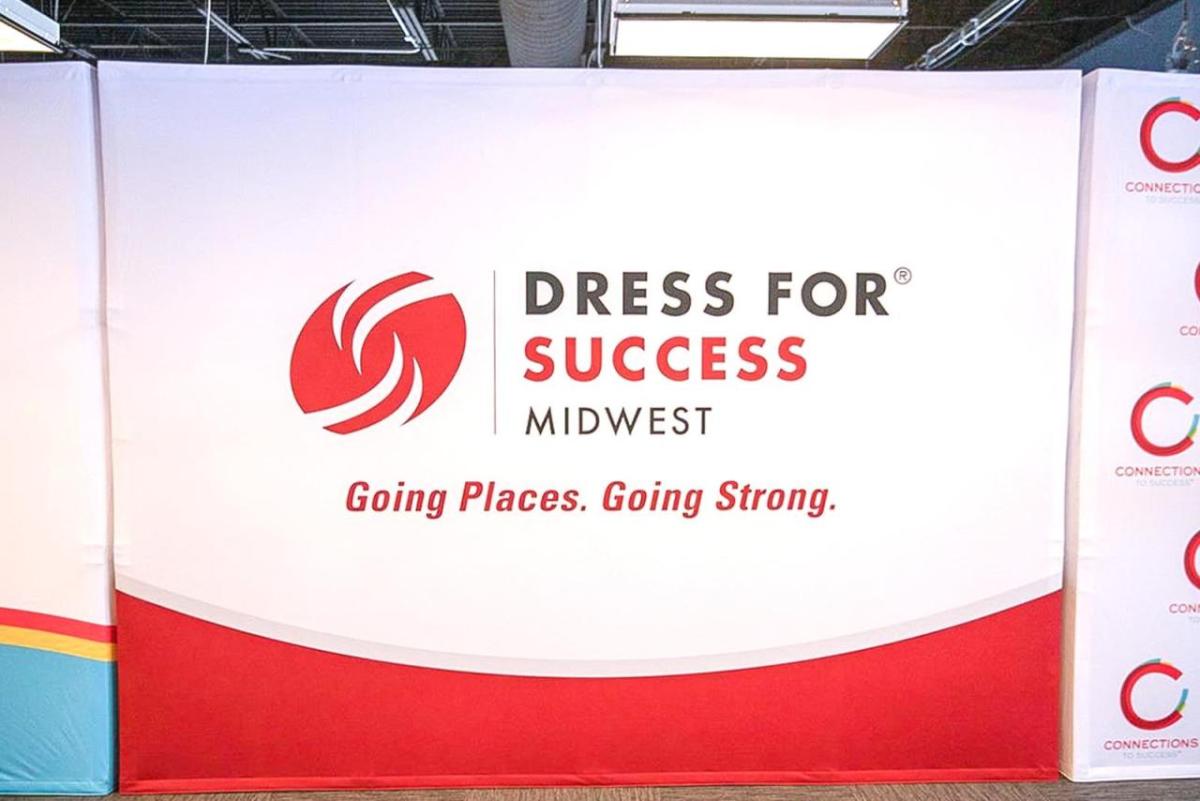 Wall with "Dress for Success Midwest Going Places. Going Strong." 