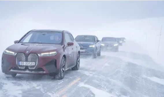 vehicles driving through snow