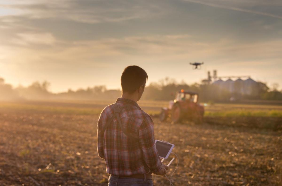 Unparalleled pipeline with estimated peak sales potential of more than 30 billion euros to promote regenerative agricultural practices and enable farmers to support both global food security and mitigation of climate change. A farmer using a controller to fly a drone over farm fields.