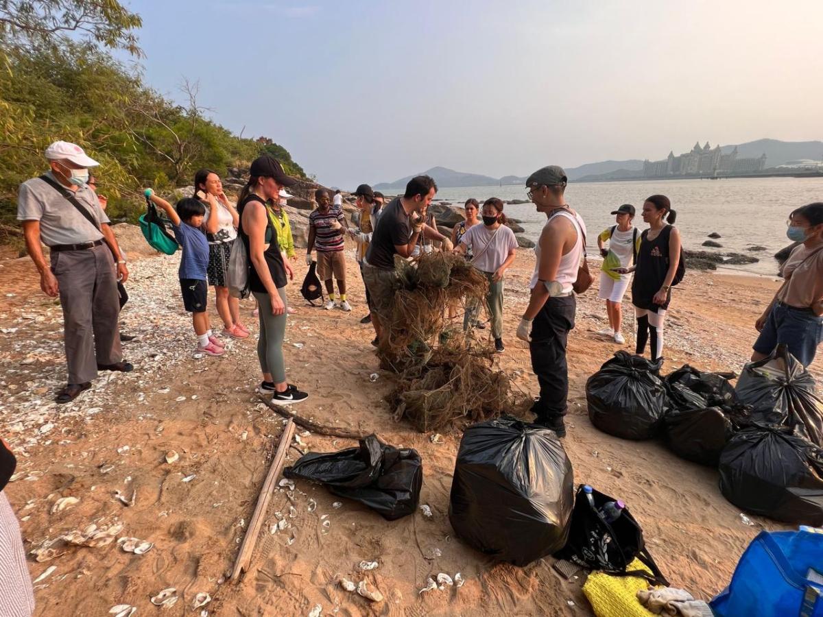 People cleaning up a beach