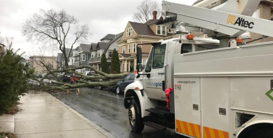 National Grid truck blocked by downed tree in street