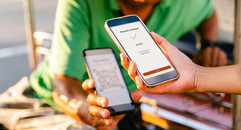 Person paying by scanning a QR code