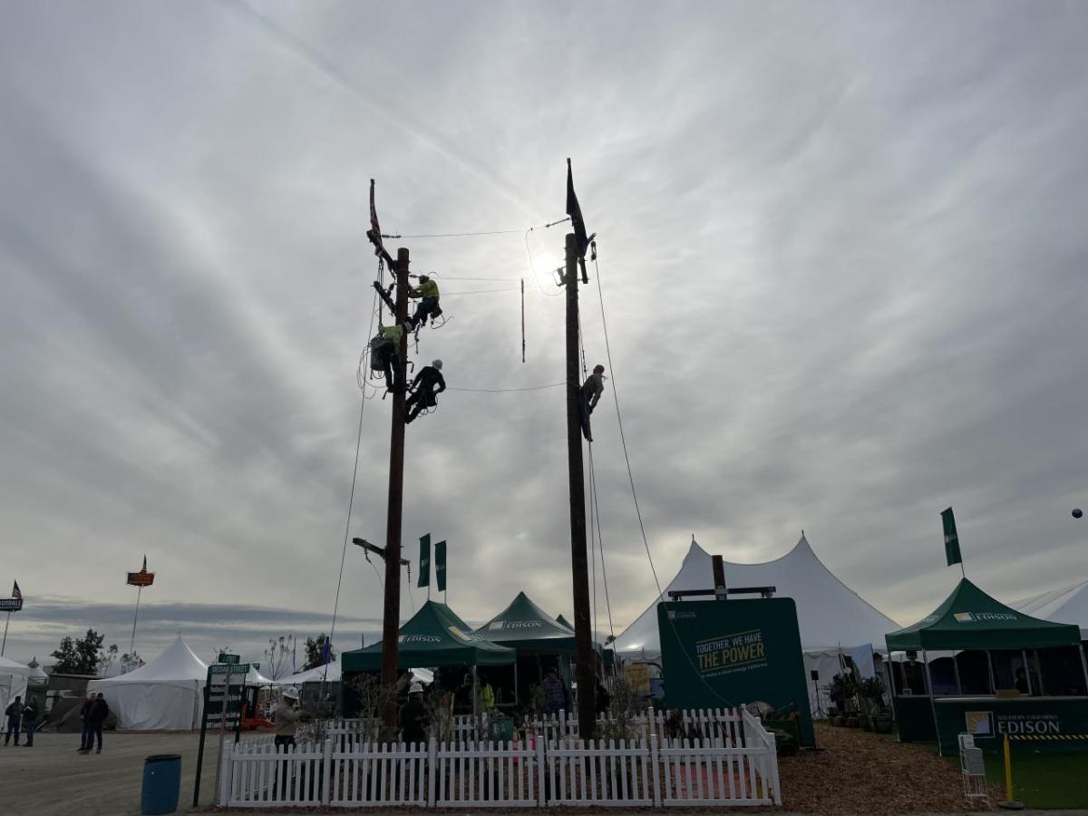 two power line poles on display at the world ag expo