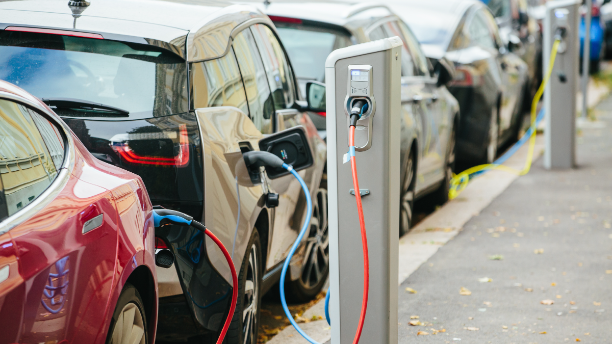 line of EVs charging while parked