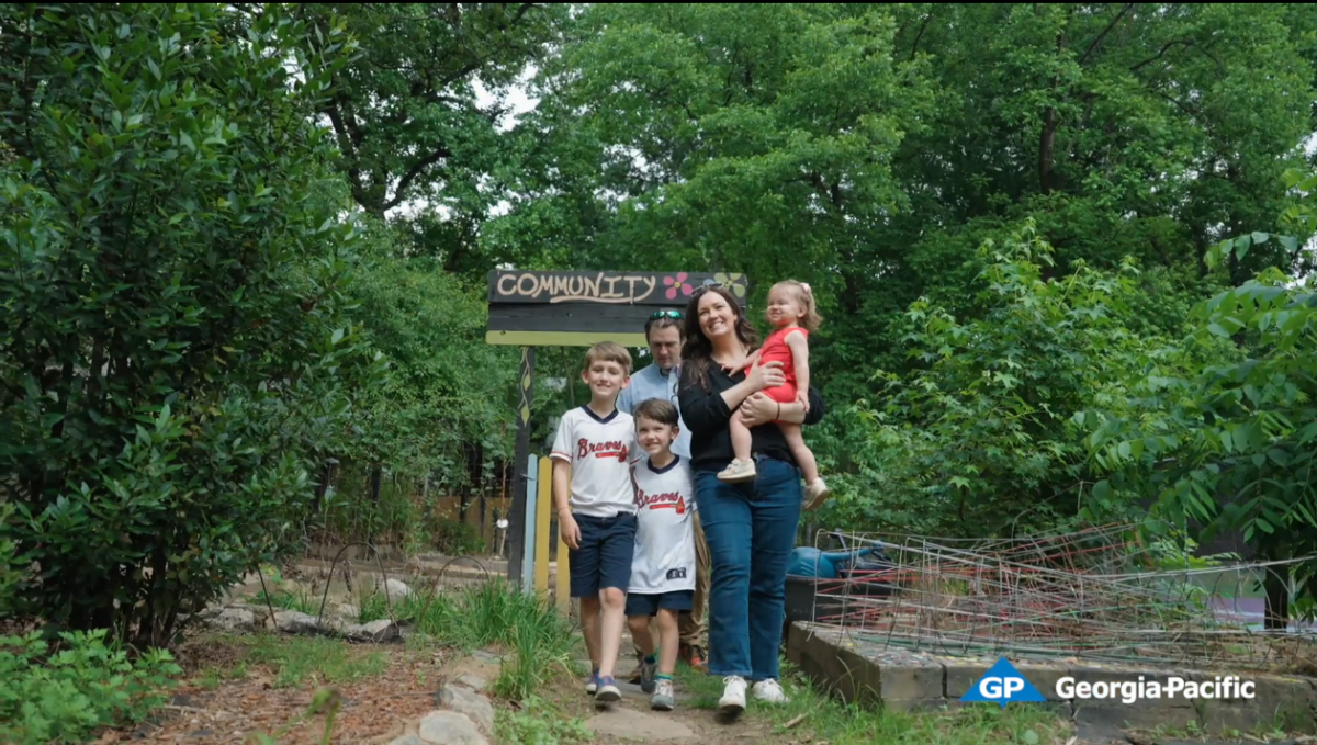 group of people walking on a trail