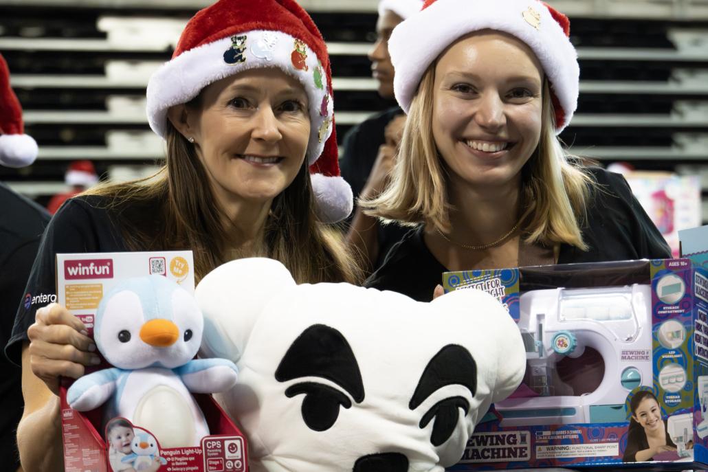 People holding up toys