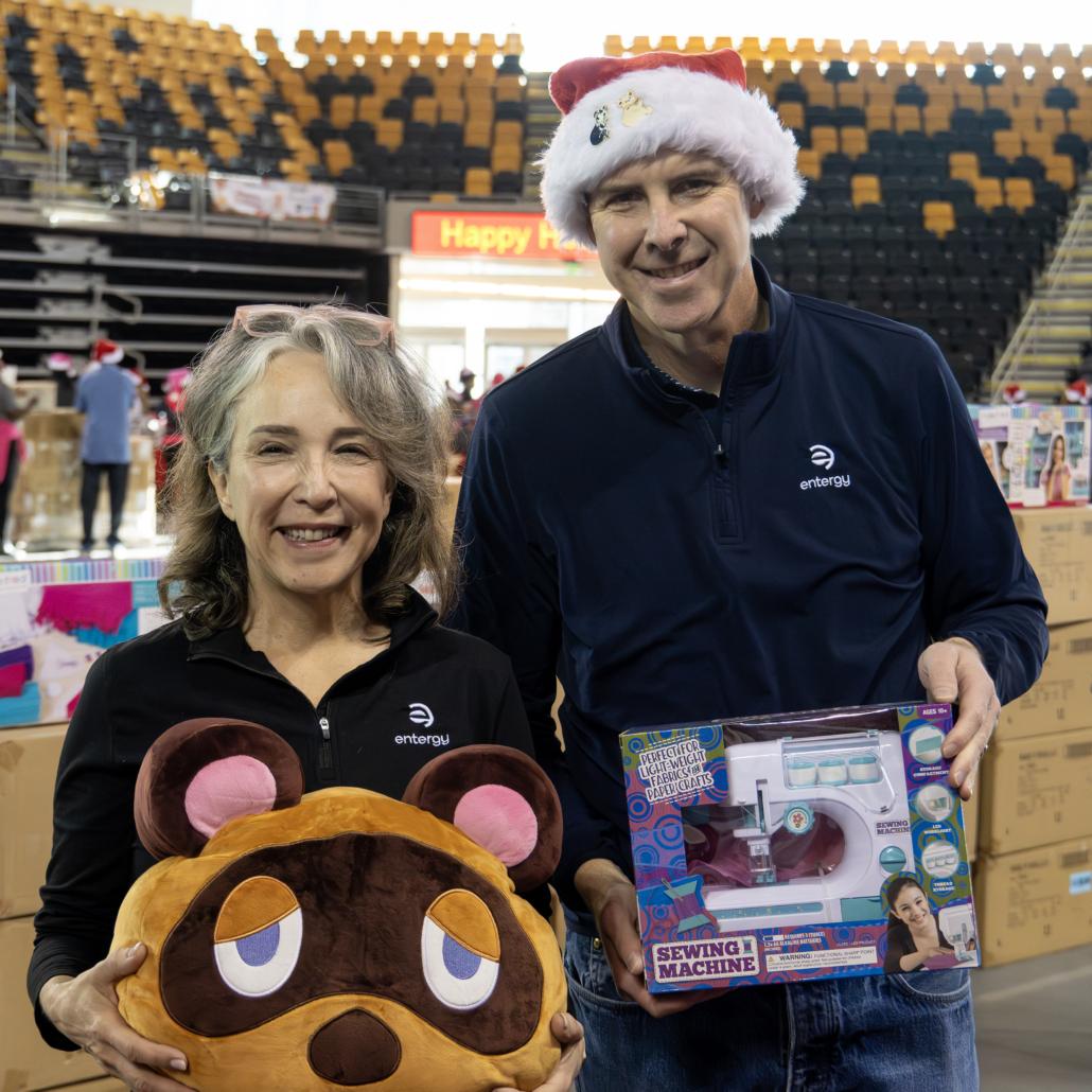 people holding up toys