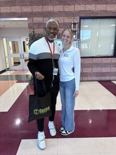 Isabella shown with a teacher.