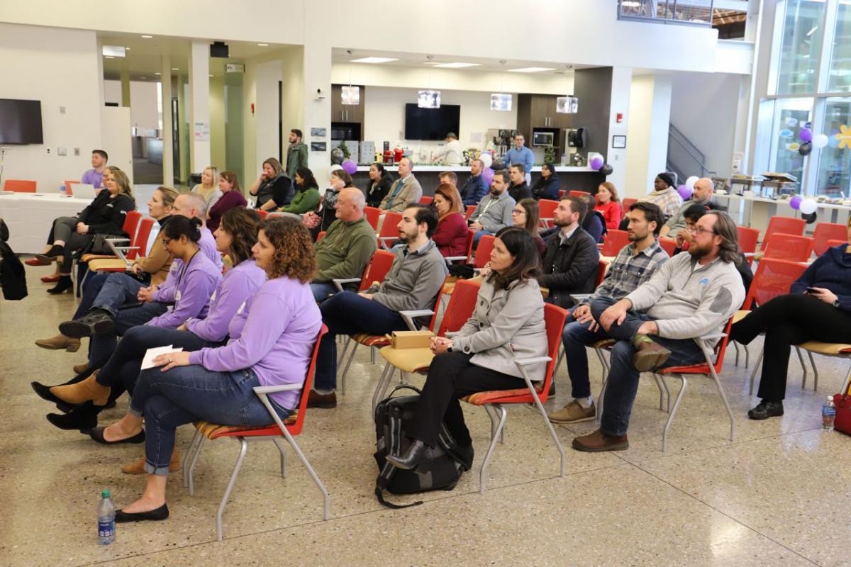 A room of seated people.