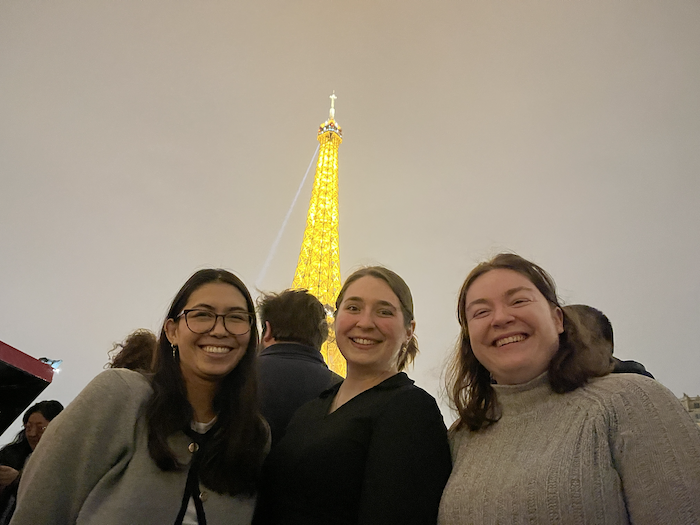 Students of Saint-Gobain EOM program in Paris with the Eiffel Tower in the background.