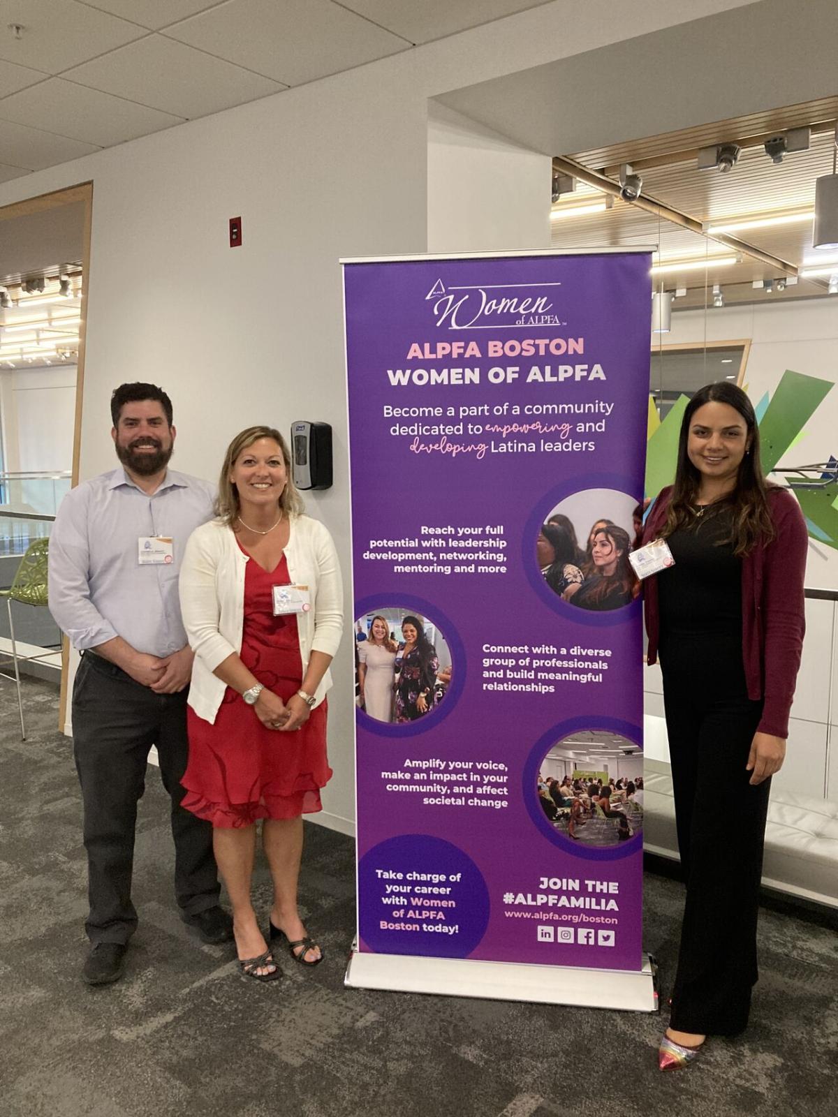 Members of Alkermes’ MOSAIC employee resource group standing next to ALPFA BOSTON poster 