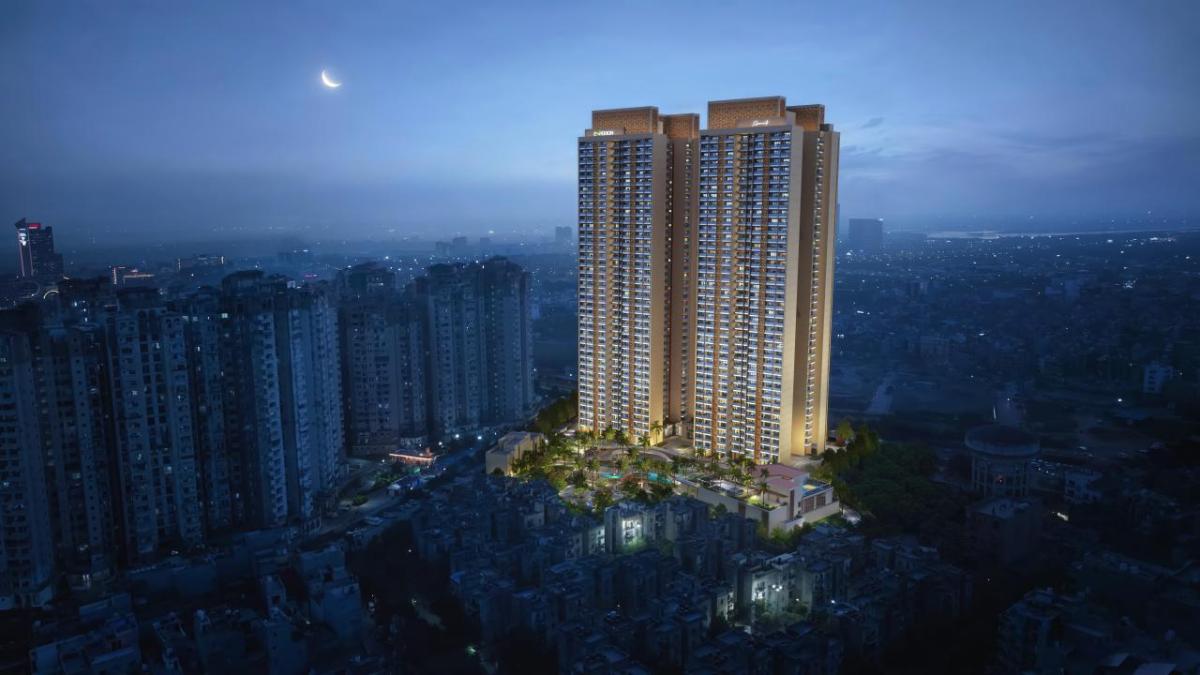 A tall, illuminated building at night