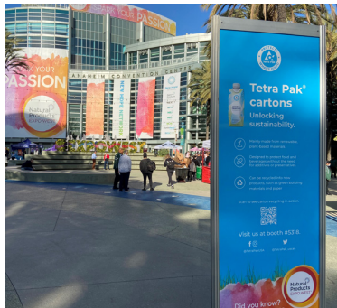 Outside a convention center. Tetra Pak cartons sign.