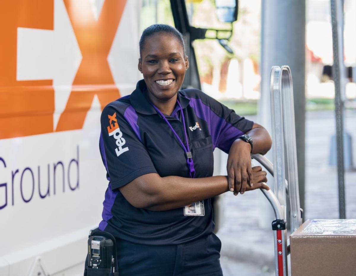 smiling FedEx employee