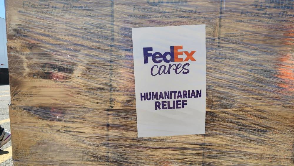 Close up of a wrapped pallet marked with "FedEx cares Humanitarian relief".