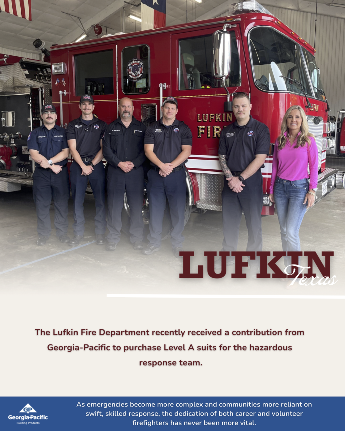 Group from the Lufkin fire department standing by fire truck
