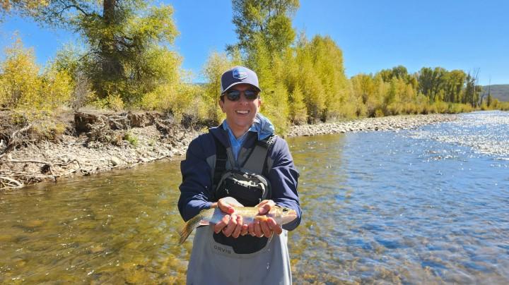 a person holding a fish