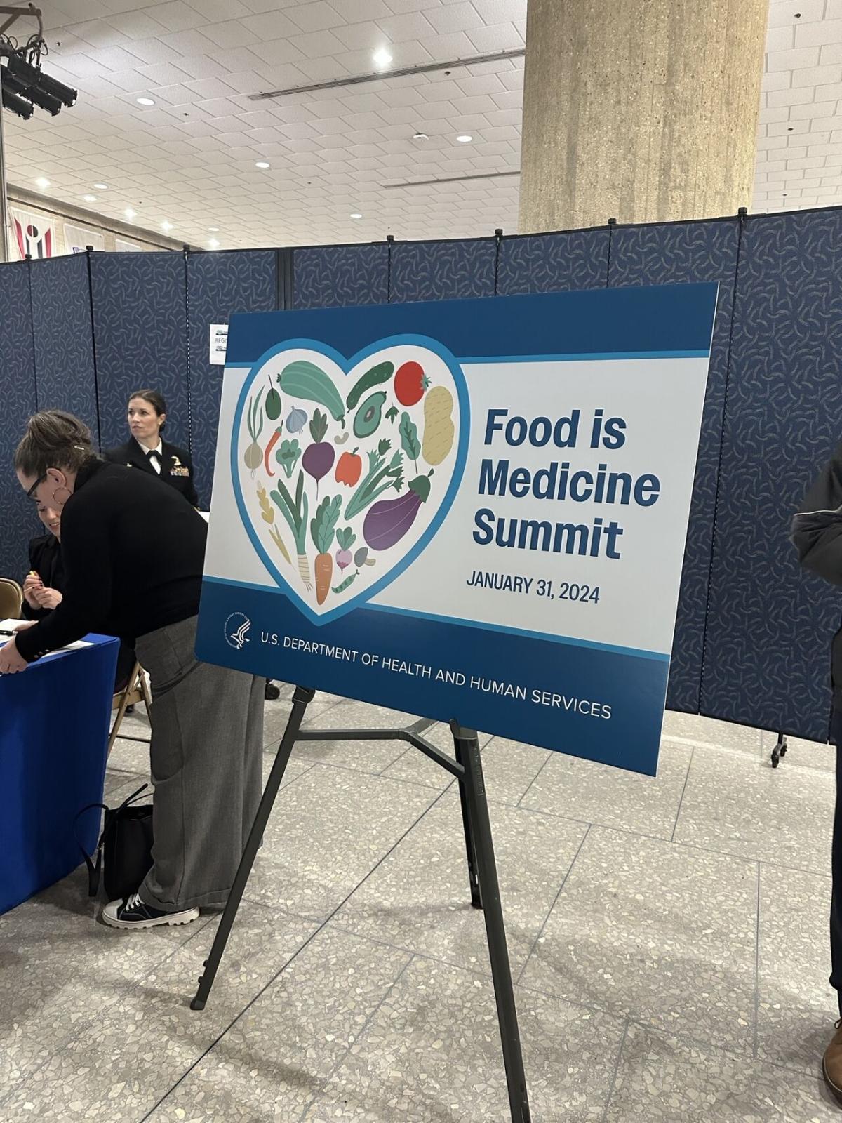 A board on display "Food is Medicine Summit"