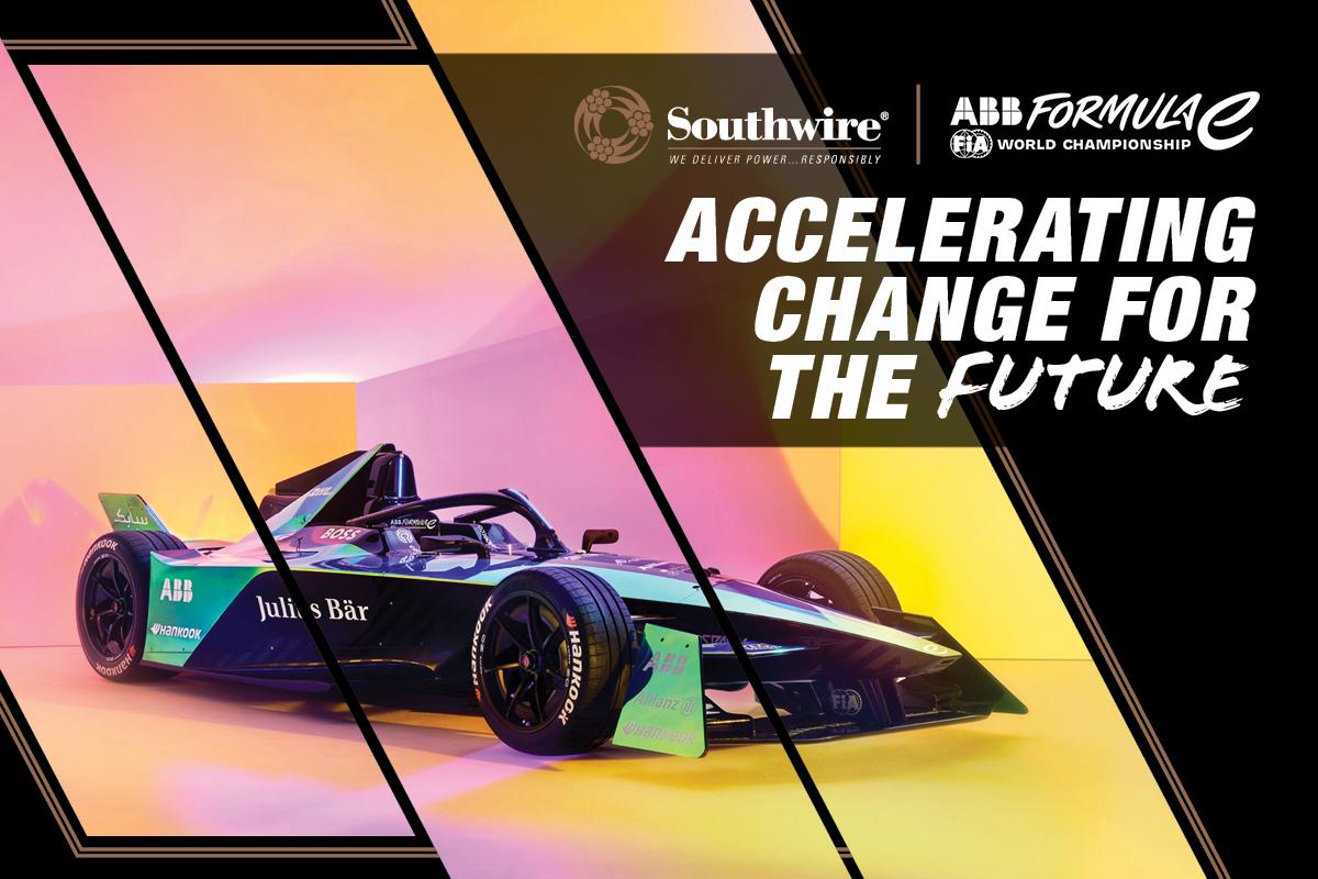 "Accelerating change for the future" Formula 1 type race car with pink and yellow lighting. Southwire logo and ABB formula E logo.