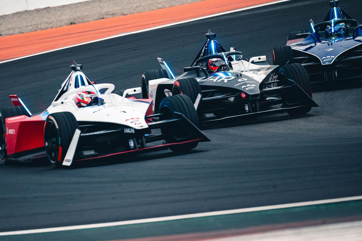 Formula E cars racing on a track