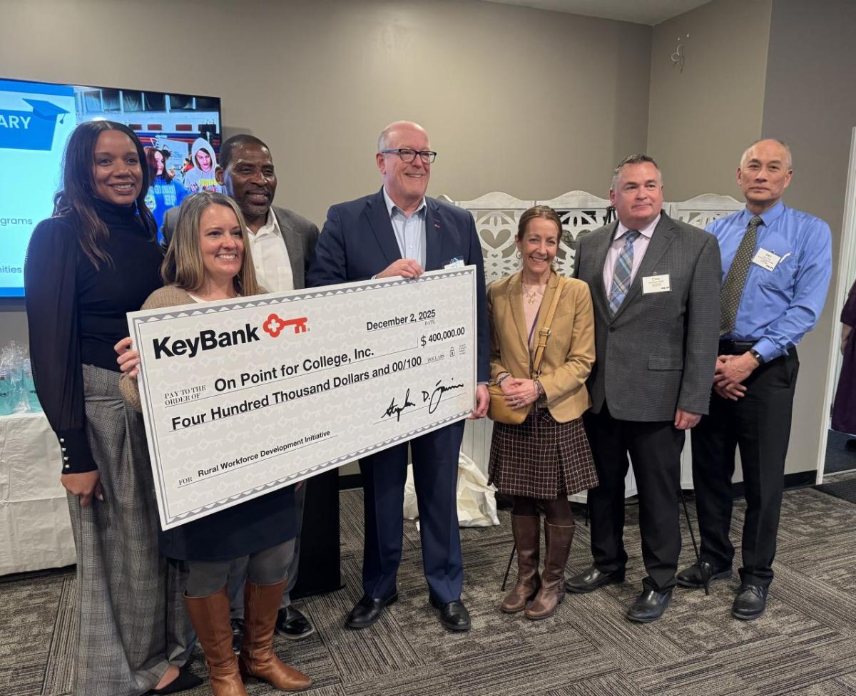 People holding an oversized check