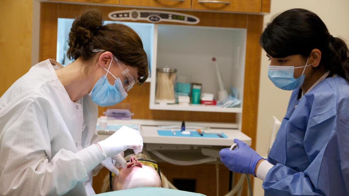 Dentists provide services to a patient in Chicago.