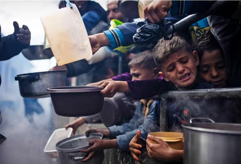 Palestinians line up for free meals in Rafah, Gaza, on Feb. 16. // Photo by Fatima Shbair / AP file Palestinians line up for free meals in Rafah, Gaza, on Feb. 16. // Photo by Fatima Shbair / AP file