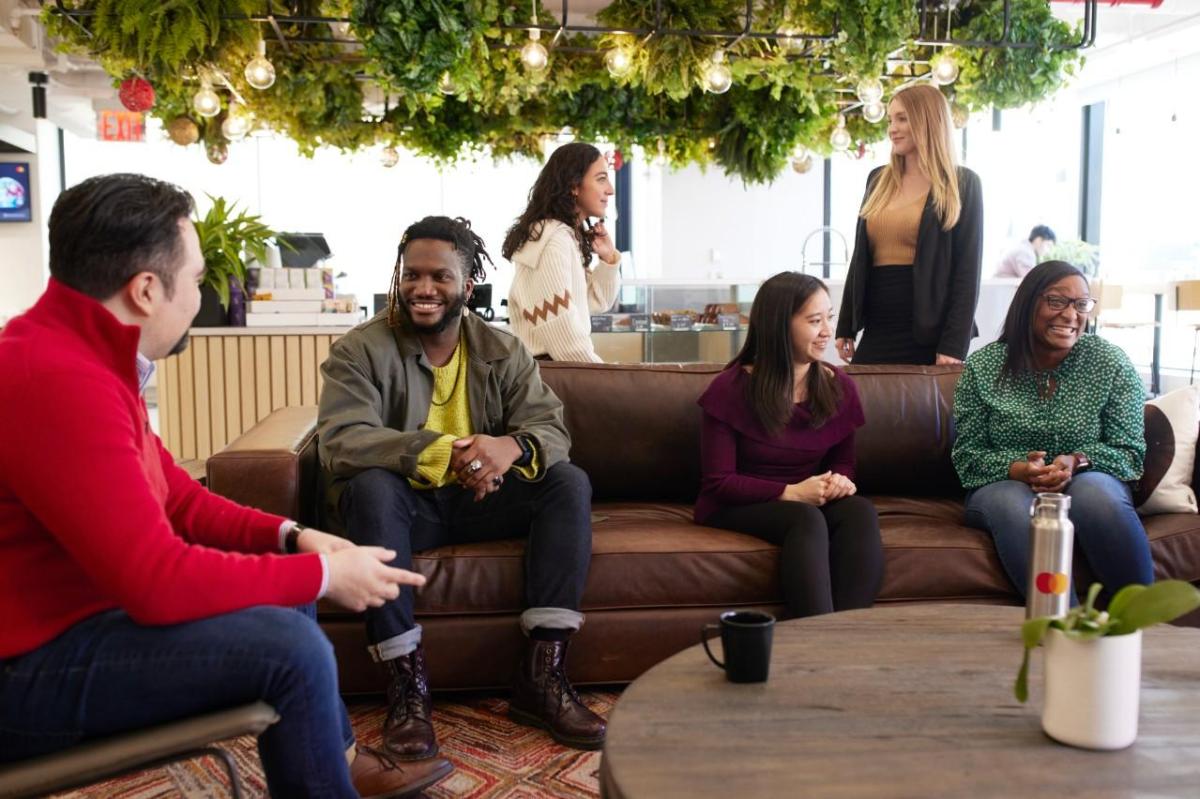 Diverse group of people sitting together and talking