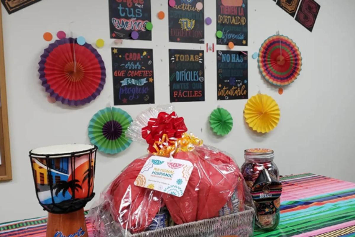 a shirink wrapped gift bag on a table with colorful drum and other decorations