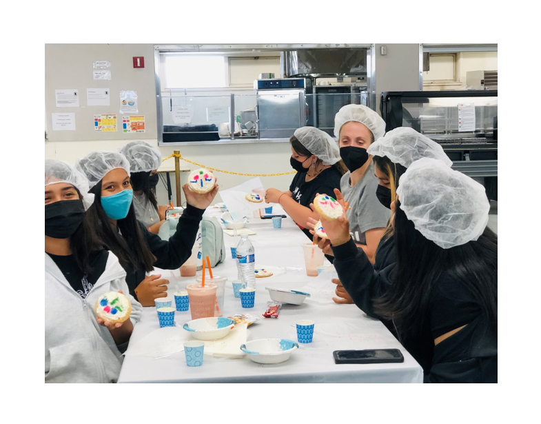 young scientists at work wearing full masks and protection