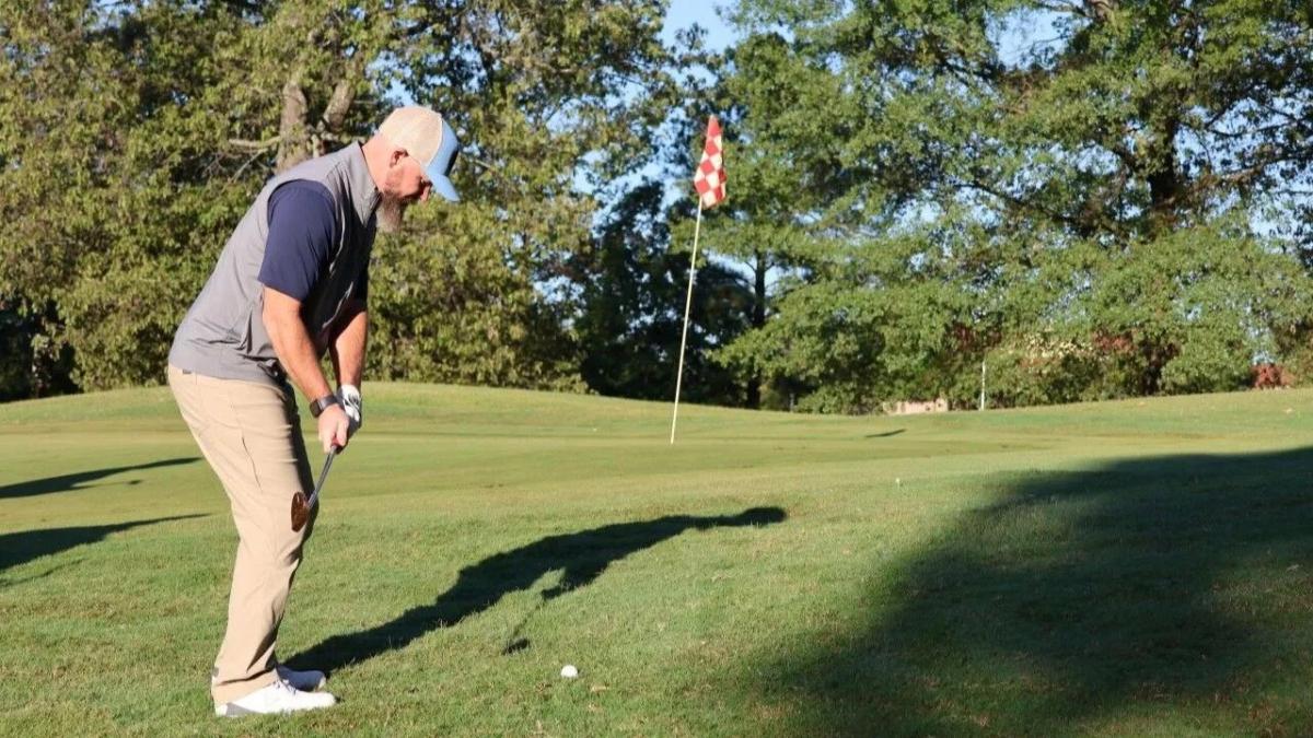 person golfing