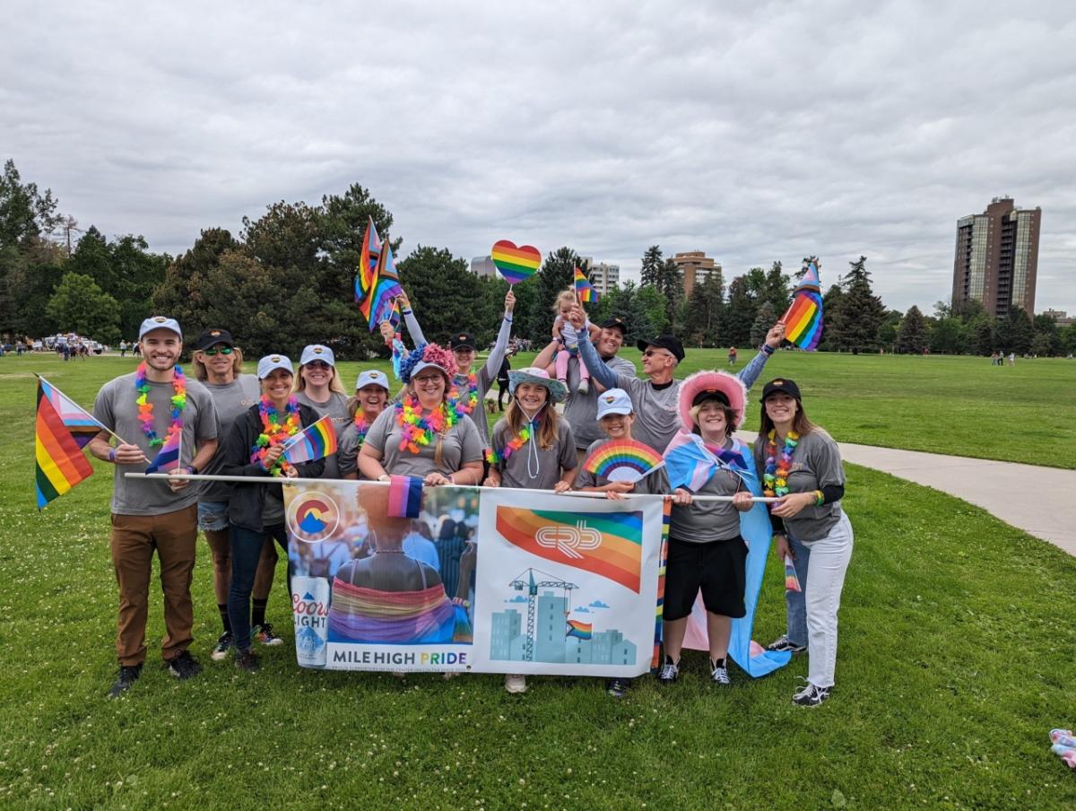 group picture with rainbow flags