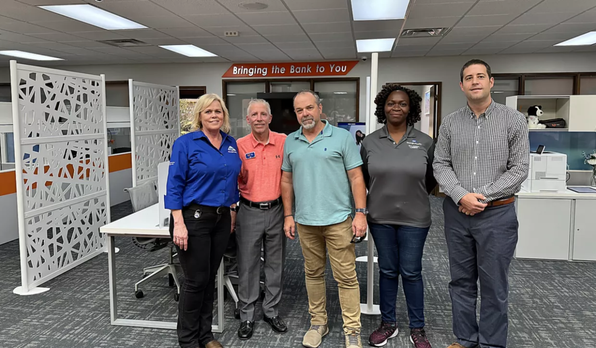 From left to right: Corina Schindel, HR business partner, Georgia-Pacific, Jim Hulse, president, CEO & chairman of the Board FBT Bank & Mortgage, Craig Sheek, plant manager, Georgia-Pacific, Ronke Adetoba, division operations development manager, Georgia-Pacific, Lance Nutt, executive vice president FBT Bank & Mortgage. Group of 5 employees