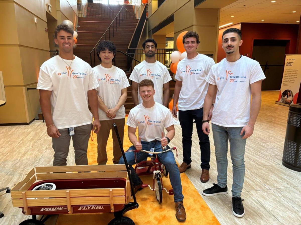 Volunteers posed by finished bike and wagon.