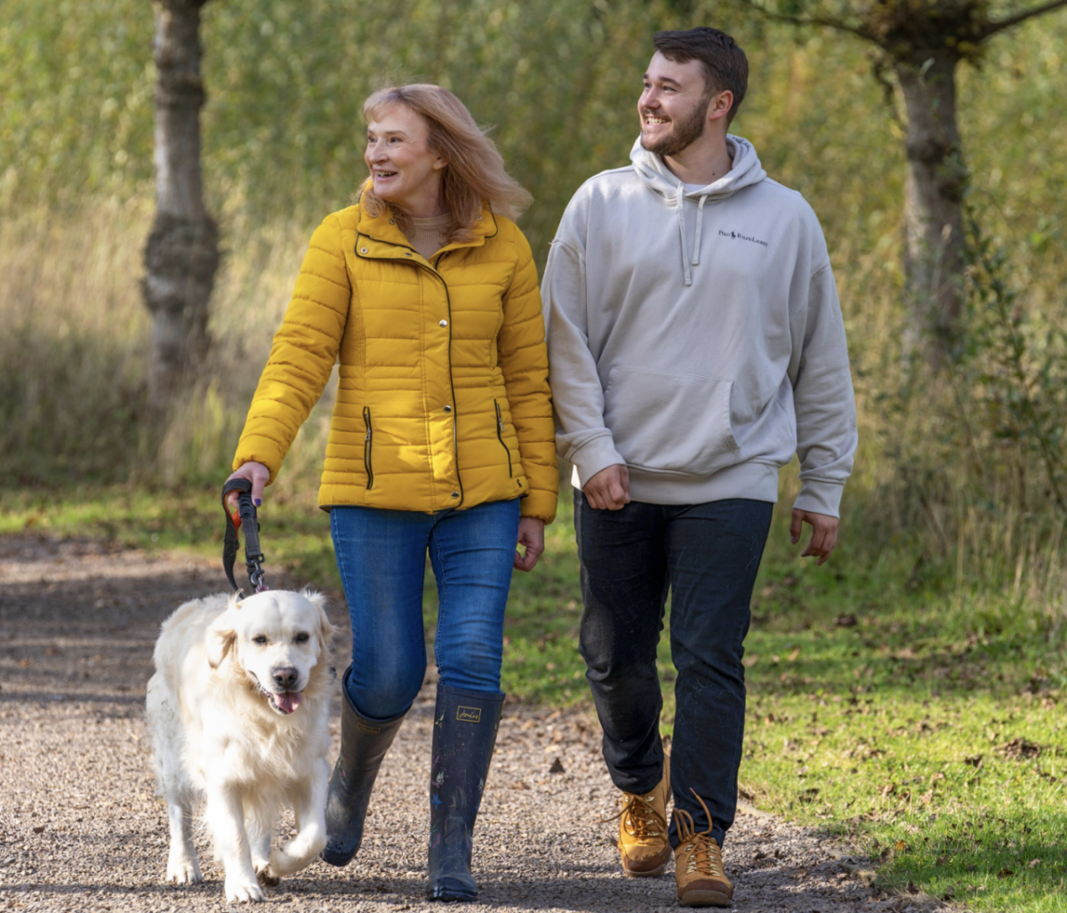 Family out walking dog