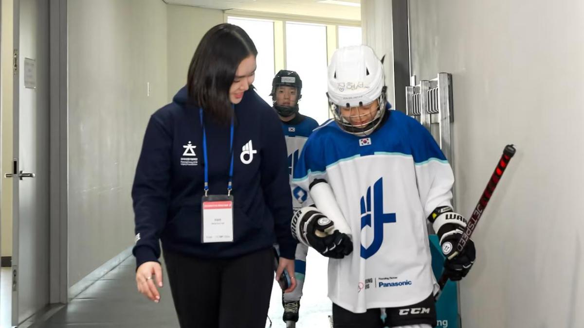hockey player with coach