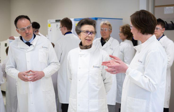 HRH Anne wearing a lab coat.