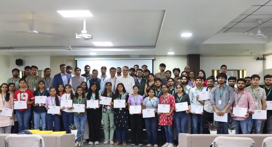 students holding up their certificates