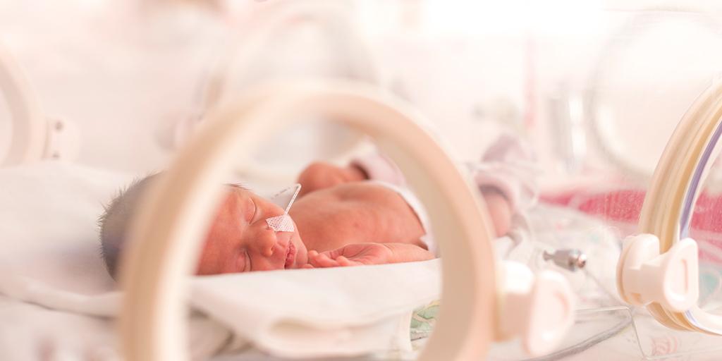 Infant sleeping in NICU.