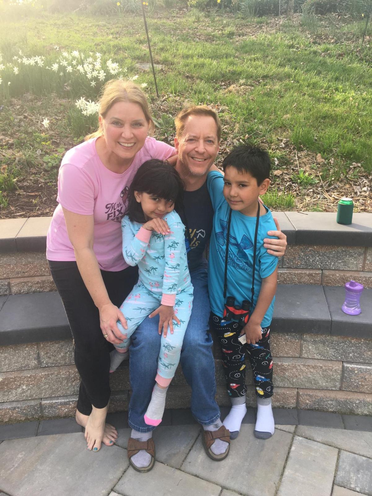 Medtronic employee Todd Gillenwater, center, used paid leave benefits from Medtronic following the adoption of his children, Ani and Plamen. He said the time away from work to bond with his kids has “meant the world.” Todd Gillenwater